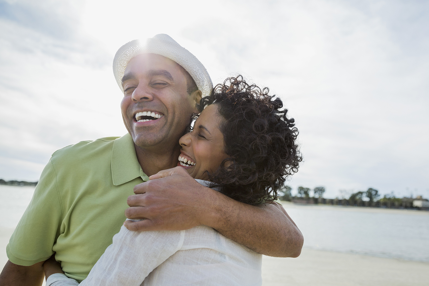 Loving mature couple embracing on beach