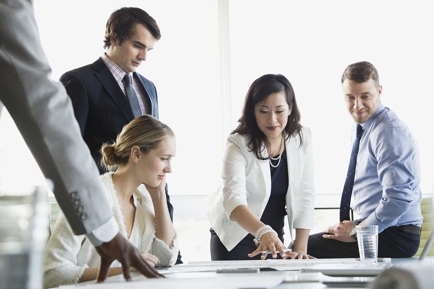 Business colleagues in discussion at conference table