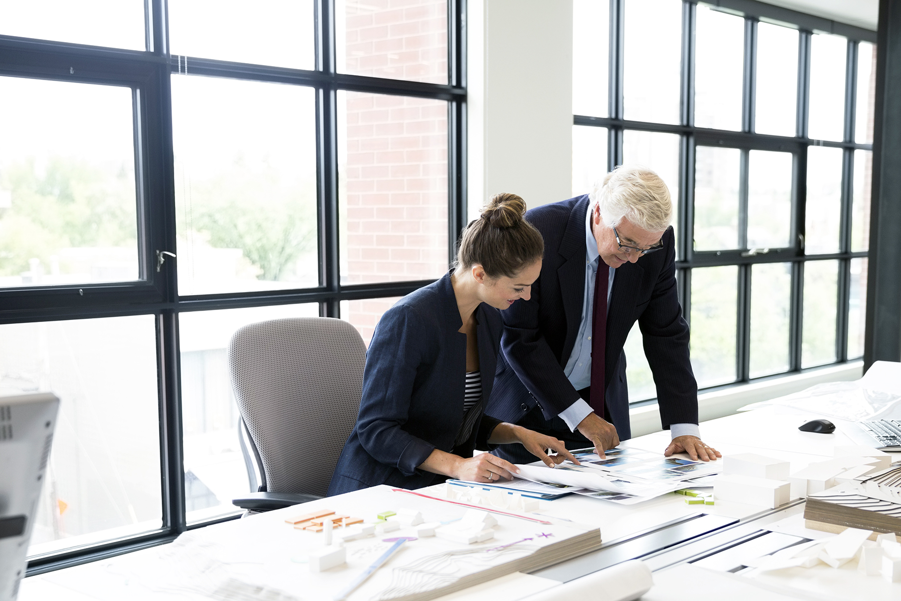 Business people working on laptop in office