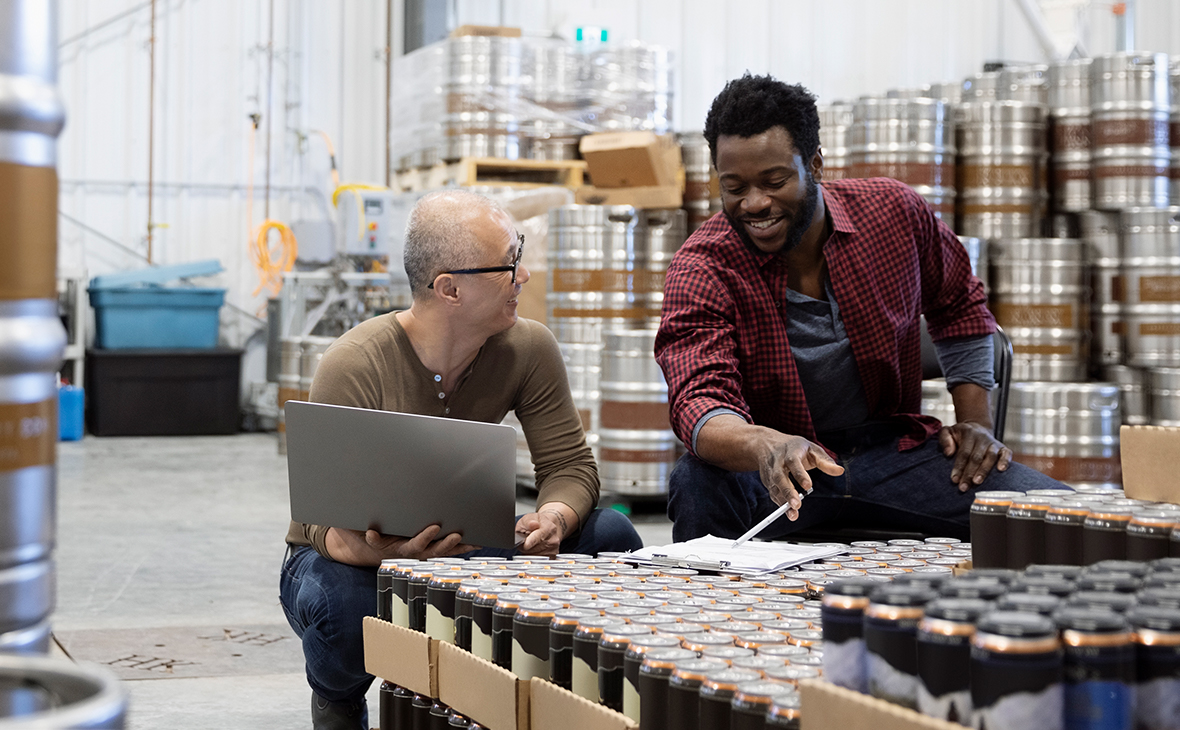 Two staff working in warehouse.