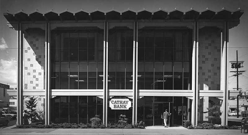 A photo scan of a black and white film image capturing a man walking