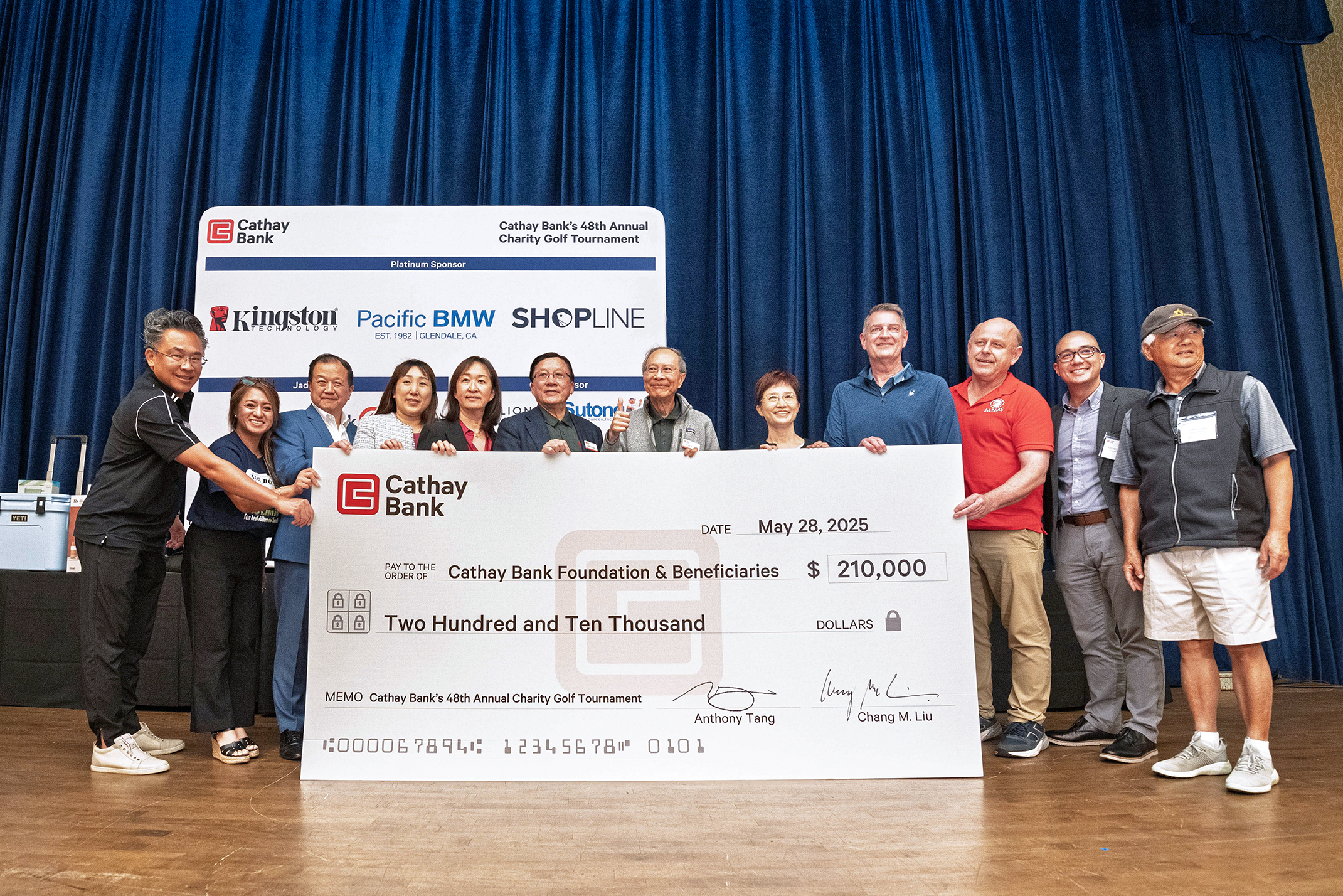 Cathay Bank presents a $210,000 check to representatives from local nonprofits who will benefit from the funds raised at the bank’s golf tournament event.