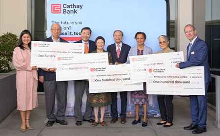Cathay Bank Foundation posted with representatives of various nonprofit organizations in a check donation ceremony.
