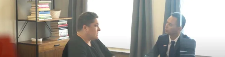 Alter Agents Founder & CEO Rebecca Brooks speaking to a Cathay Bank banker in a business meeting. 