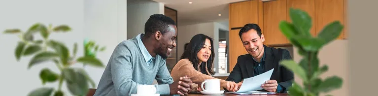 A person holds their cellphone and taps on the screen showing their investment options on a finance app.