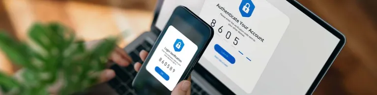 A client logs onto their online banking platform through a laptop using two factor authentication through their mobile device.