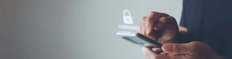 Hands holding a smartphone with a padlock icon overlay, symbolizing mobile security and data protection against Godfather Malware.