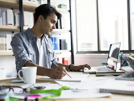 Architect working at laptop in office