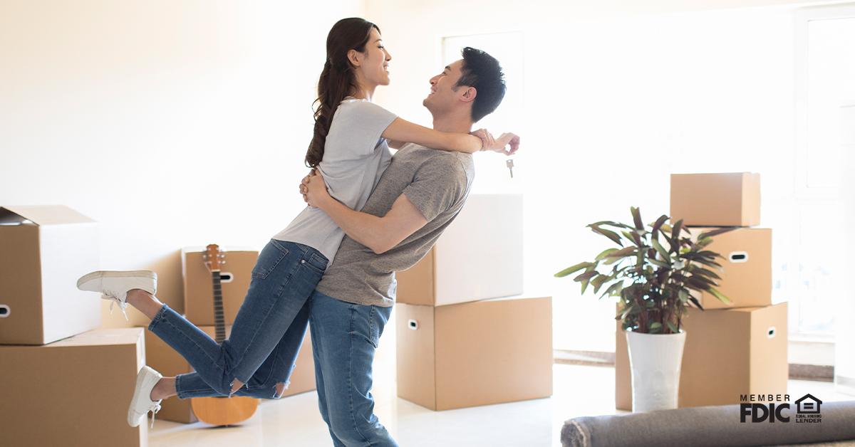 Happy young couple moving to a new house