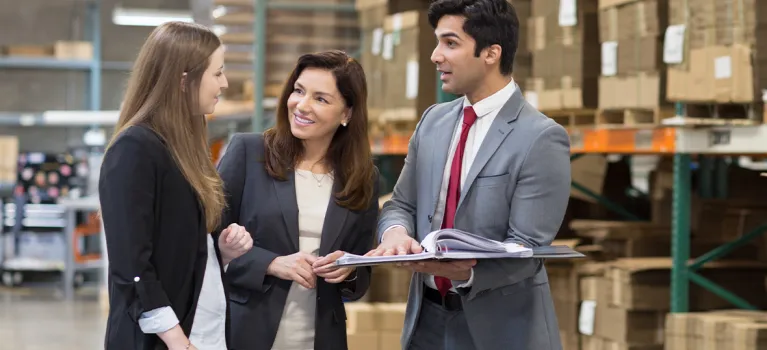 A Cathay Bank officer discussed business lending with two businesswomen. 