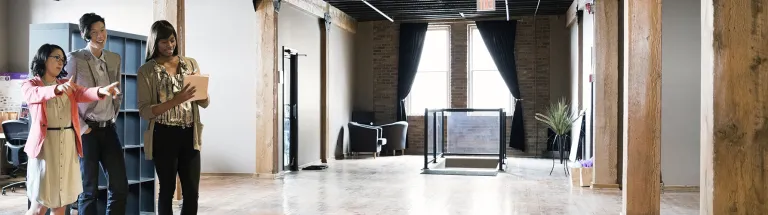 Entrepreneurs looking at creative office space