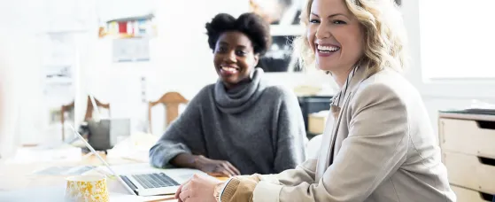 Smiling designers meeting in office