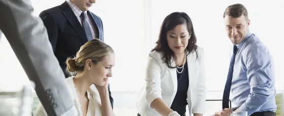 Business colleagues in discussion at conference table