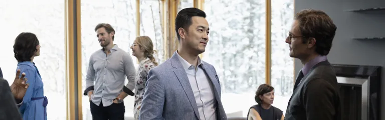 Businessmen talking, networking at conference