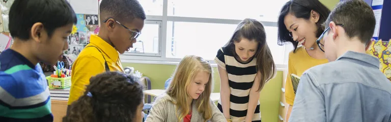 Teacher and elementary students in classroom