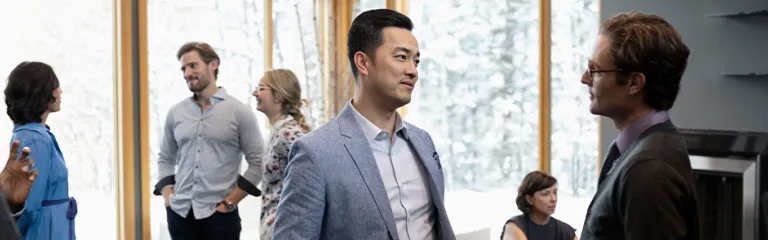 Businessmen talking, networking at conference