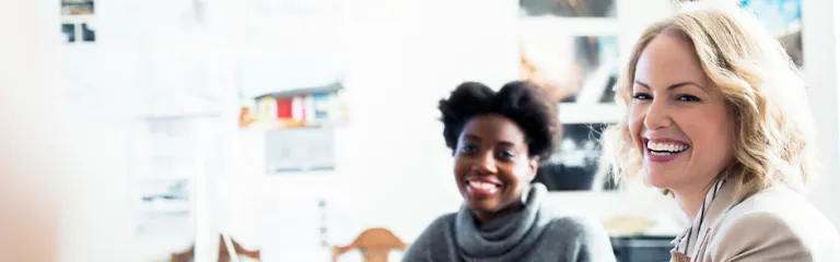 Smiling designers meeting in office