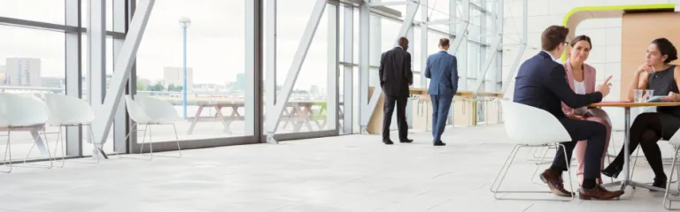 Business people discussing plans in a lobby
